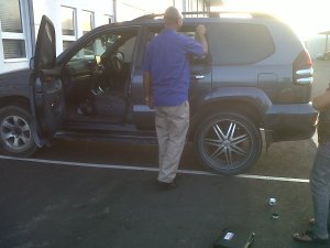 Policeman dusting car for fingerprints!!