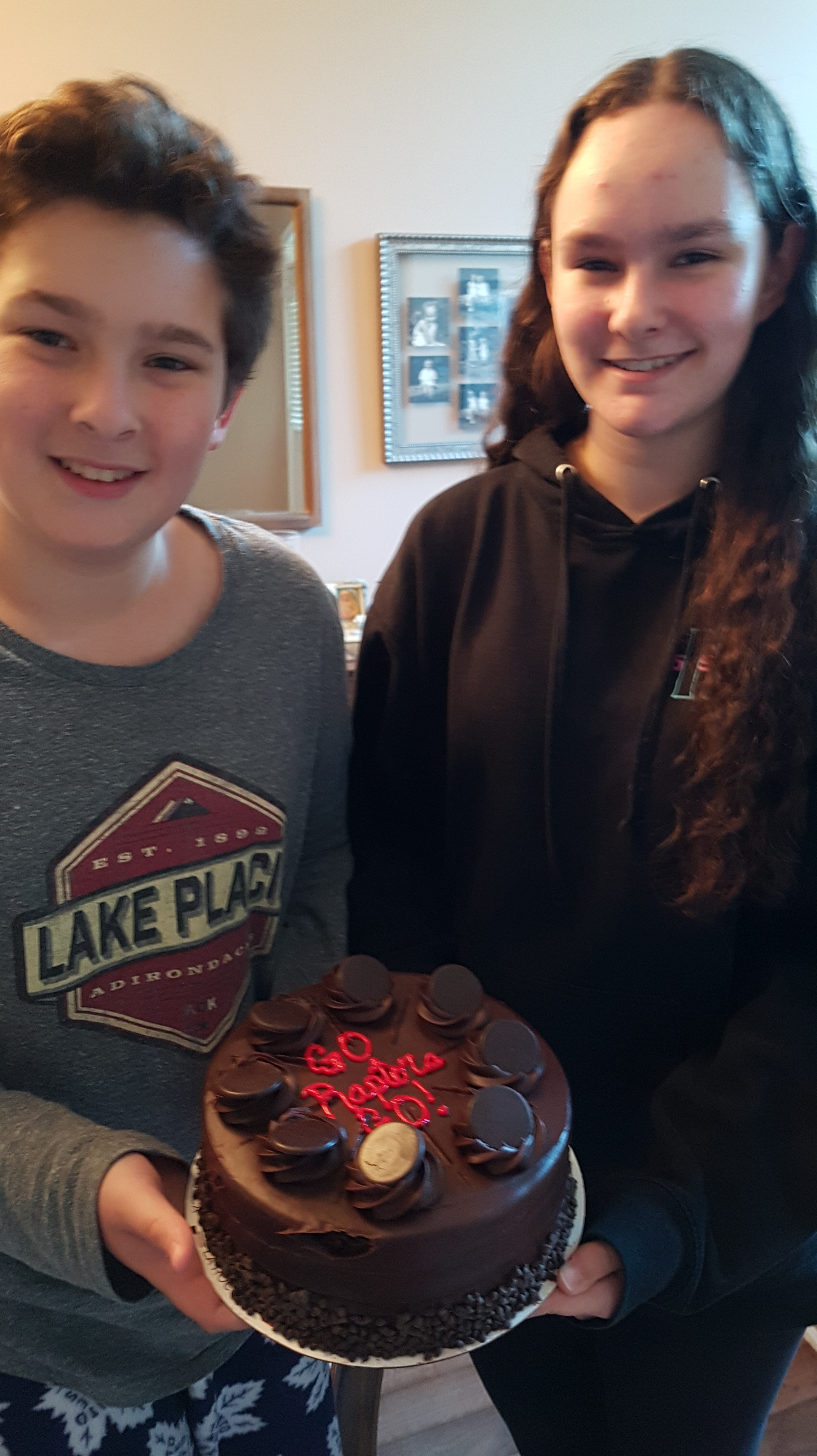 Ben and Megan, my grandkids, with their Raptor's Cake for the Basketball Championships